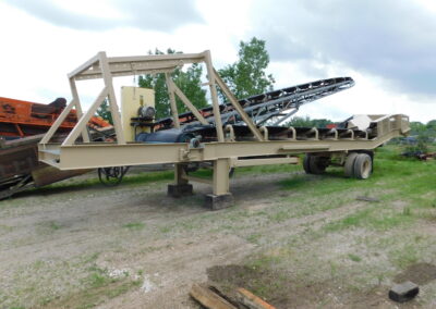 AMI dog leg conveyor/crusher discharge conveyor with legs.